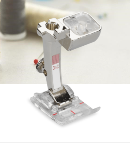 BERNINA Reverse Pattern Foot with Clear Sole #34C Guarantees excellent fabric feed For forward and reverse-feed stitches The clear sole ensures a good view of the sewing area The red markings allow accurate and careful sewing For 9 mm machines